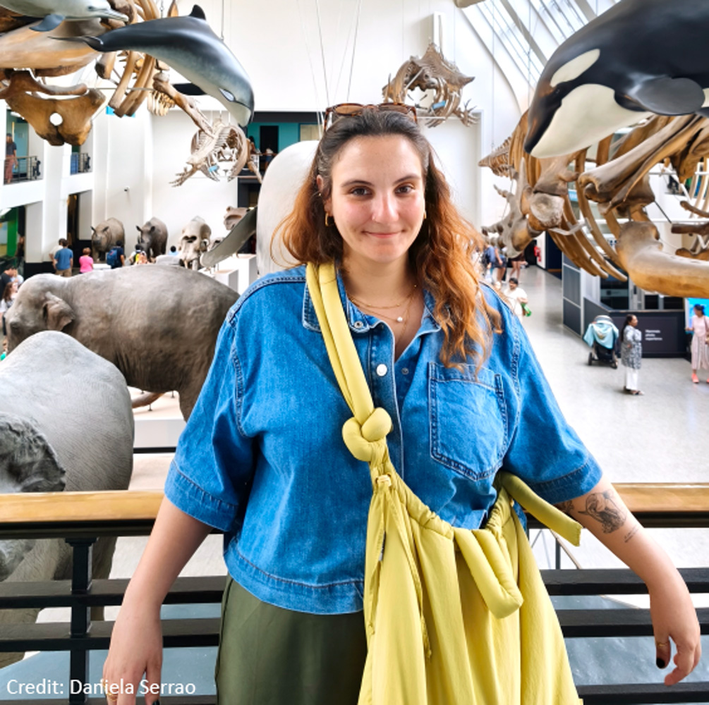 A portrait photo of a woman (Filipa Afonso) at the Natural History Museum.